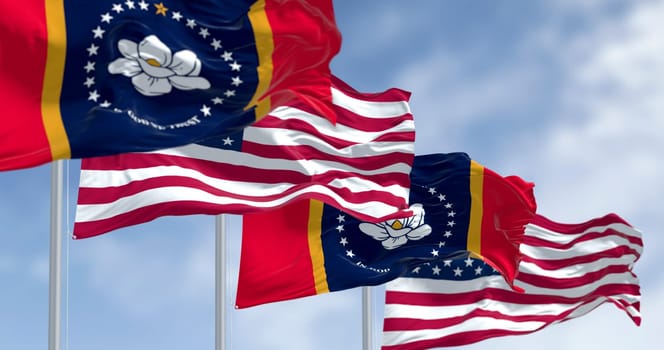Photorealistic 3D render of Mississippi and United States flags flying on flagpoles, symbolizing unity, freedom, and patriotism on a sunny day.