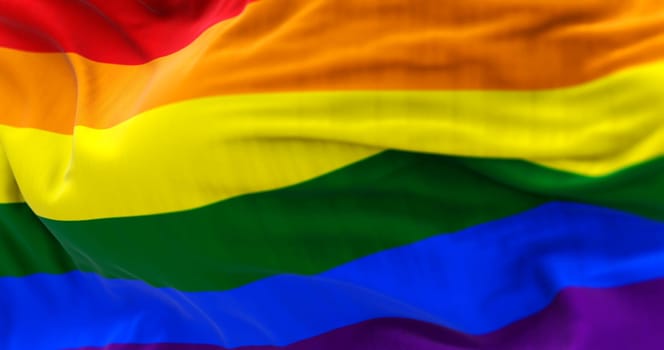 3D render of the rainbow flag fluttering in the wind, symbol of LGBTQ+ pride, freedom, equality and diversity.