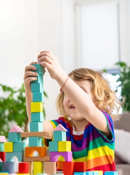 A child builds from blocks. Selective focus. kid.