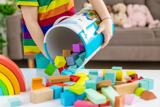 A child builds from blocks. Selective focus. kid.