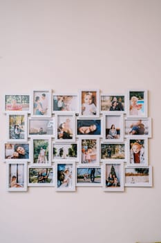 White photo collage frame with family photos hanging on the wall. High quality photo