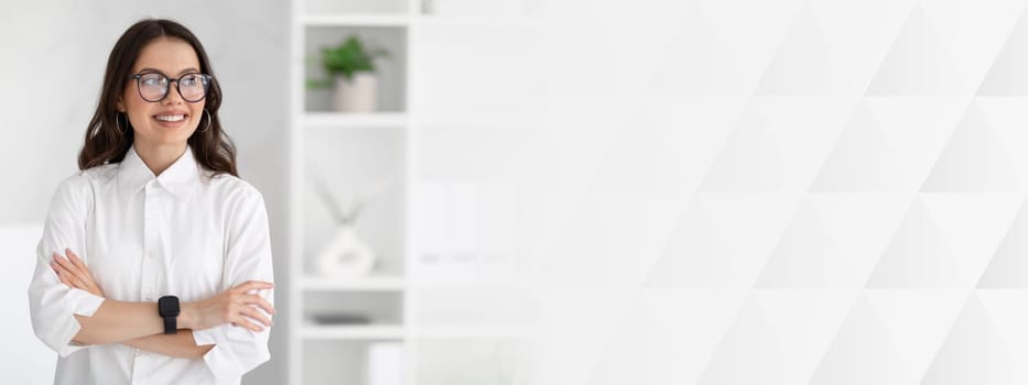 Cheerful young caucasian business woman in white shirt and glasses enjoys professional occupation, looking at copy space in office interior. Business and work, official lifestyle and ad, offer