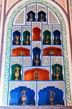 ancient Uzbek copper and brass jugs on exhibition in Museum in Tashkent in Uzbekistan