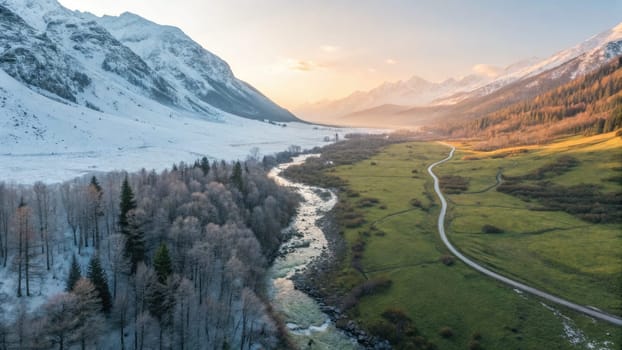 Snow-covered peaks tower over a serene valley as a winding river meanders through thriving greenery.