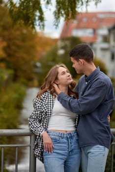Young Cute Female Hugs Boyfriend. In Autumn Outdoor. Lovers Walking in Park. Attractive Funny Couple. Lovestory in Forest. Man and Woman. Cute Lovers in the Park. Family Concept. Happy Couple.