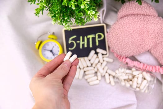 5-HTP sleep supplement capsules. Selective Focus. night.