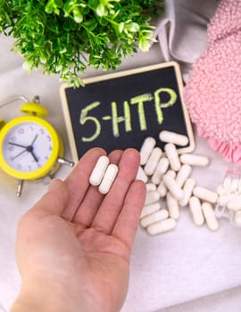 5-HTP sleep supplement capsules. Selective Focus. night.