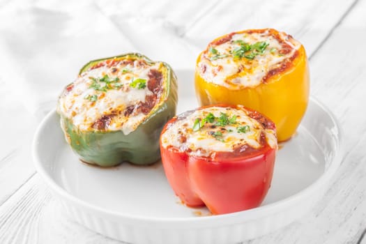 Vibrant bell peppers are baked to perfection, generously stuffed with rich bolognese sauce, and crowned with melted mozzarella