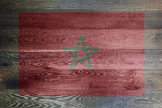 A Morocco flag on rustic old wood surface background