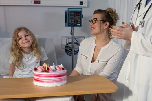 A heartwarming hospital scene featuring a child, a loving mother, and a festive cake for a special occasion