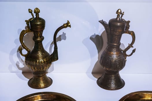 two antique traditional Uzbek copper and brass jugs on exhibition at Museum of Antiques in Tashkent in Uzbekistan