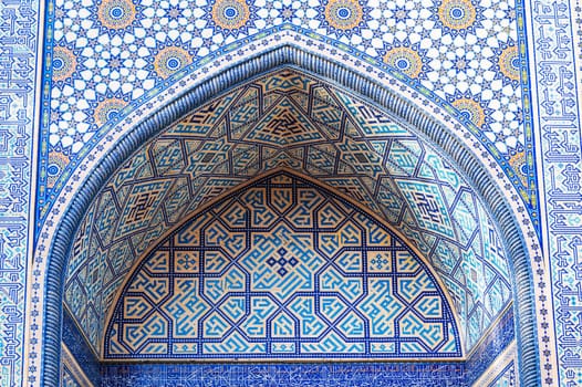 arch of Muslim mosque decorated with ceramic tiles with a traditional Uzbek oriental islamic pattern in Tashkent in Uzbekistan