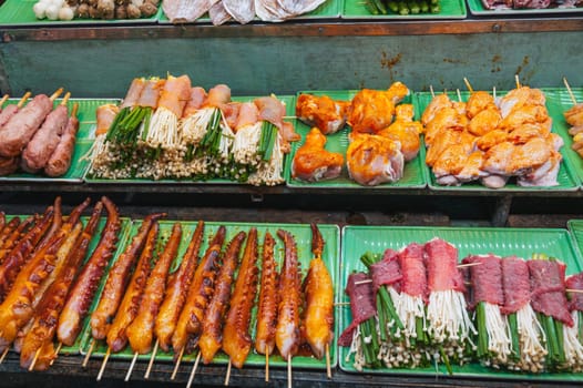assortment of traditional Vietnamese street food on the counter at the Asian Night Market in Vietnam in Asia in Da Nang
