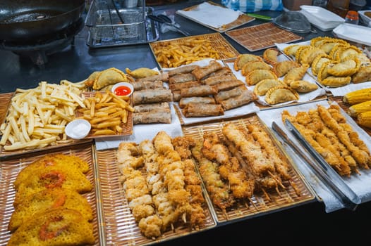 Traditional Vietnamese food and pastry on counter at the Asian night market on street in Vietnam in Asia in Da Nang