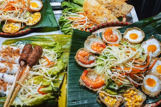 Traditional Vietnamese food on counter at the Asian night market on the street in Vietnam in Asia in Da Nang