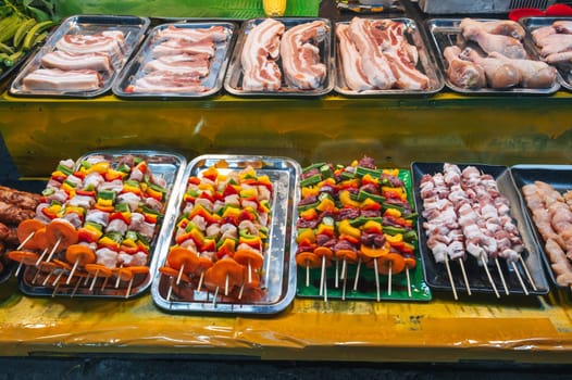 traditional Vietnamese food and meat barbecue at the Asian night market on the street in Vietnam in Asia in Da Nang