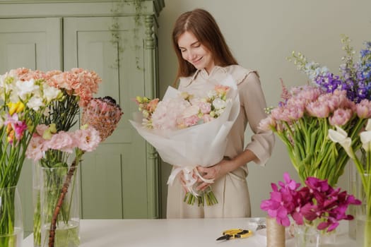 Florist arranging elegant bouquet in flower shop, surrounded by fresh blooms, smiling with joy. flower shop