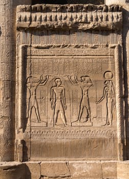 Bas-relief carvings of gods and kings on the well-preserved facade of the Temple of Esna with carvings