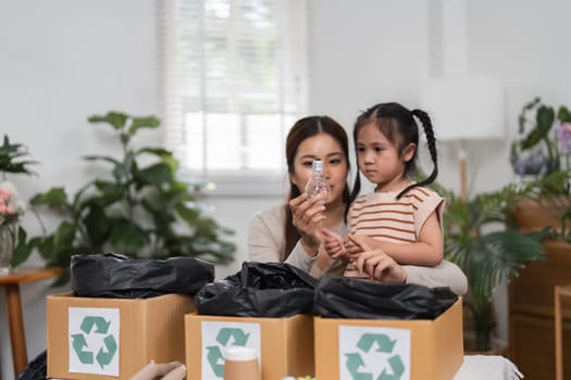A mother and daughter share a special moment as they explore the importance of recycling