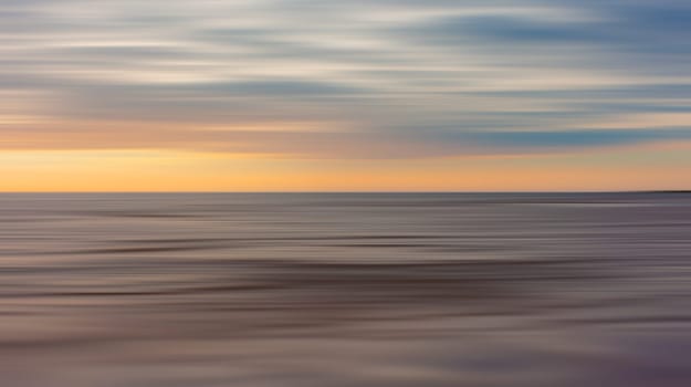 Abstract view of the sea and clouds in motion blur style . Pastel, dreamy scene.