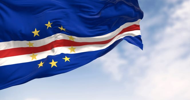 Cape Verde national flag waving on a clear day. Blue, white, and red bands with ten yellow stars representing the main islands. 3d illustration render. Rippled fabric. Selective focus