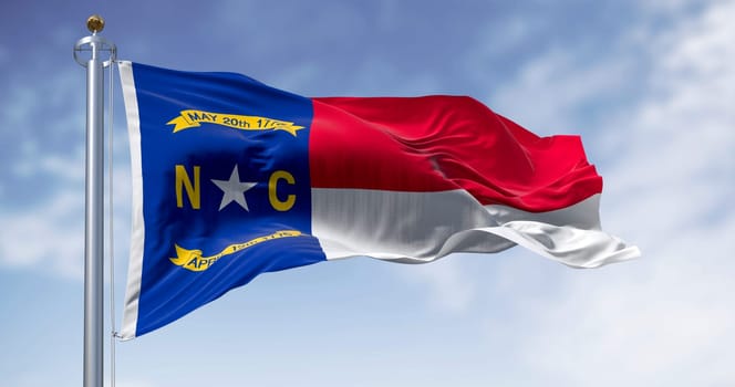 North Carolina state flag waving. North Carolina is a state in the Southeastern region of the United States. Rippled fabric. 3d illustration render. Rippled fabric. Selective focus