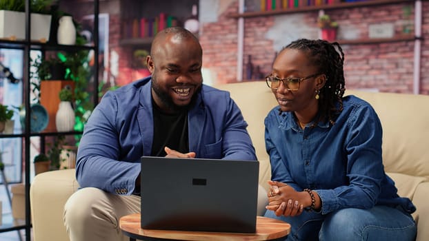 African ameircan people meeting with colleagues remotely on video call, discussing about tasks details and meeting on teleconference for a briefing. Man and woman chatting on web. Camera B.