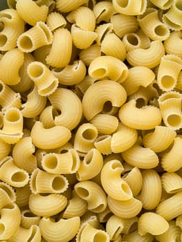 Uncooked rigate pasta, featuring the unique ridged and hollow shapes. Taken with a smartphone.