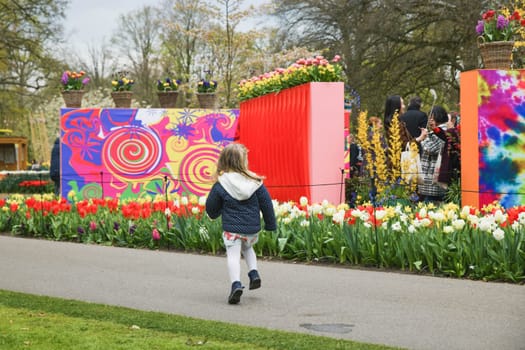 Lisse, Netherlands - April 17, 2019: People,kids and decoration in a Keukenhof park