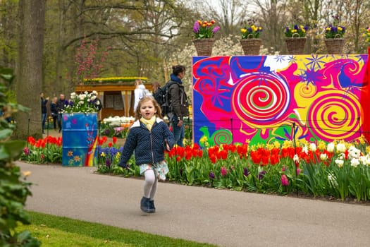 Lisse, Netherlands - April 17, 2019: People,kids and decoration in a Keukenhof park