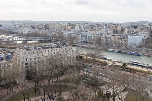 Paris city panorama, the aerial view from the Eiffel tower in soft evening light in early spring