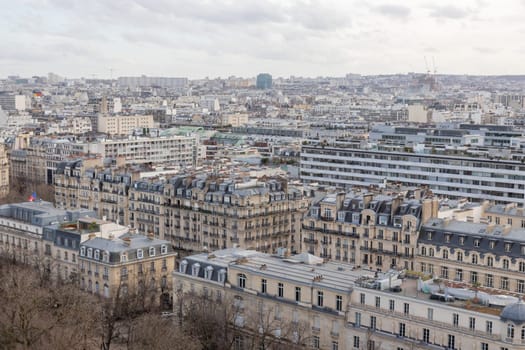 Paris city panorama, the aerial view from the Eiffel tower in soft evening light in early spring