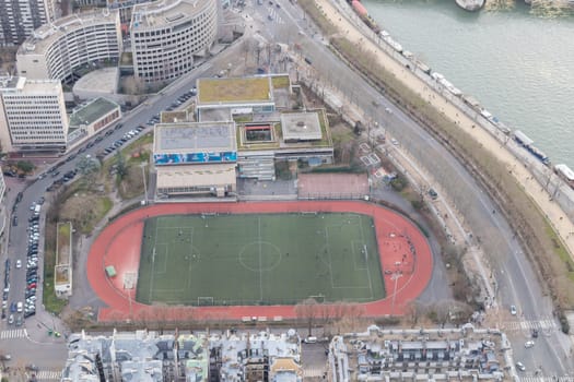Paris city panorama with Emile Anthoine Stadium, the aerial view from the Eiffel tower in early spring.