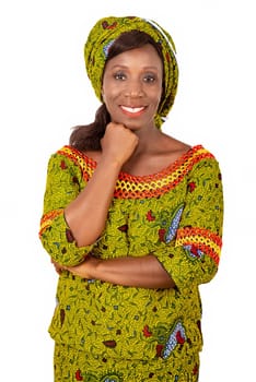 beautiful adult african woman dressed in green loincloth is smiling with arm on chin