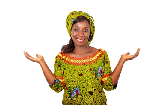 Portrait of a beautiful African adult woman wearing a green loincloth, hands ready to carry whatever things.