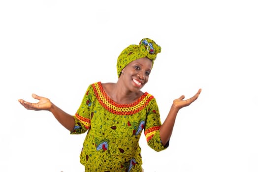 Beautiful african adult woman wearing a loincloth and a green scarf at the head with arms and hands raised smiling
