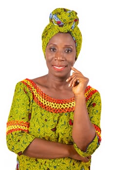 beautiful African adult woman wearing a loincloth and a green scarf is smiling with her arm crossed and her hand on her chin