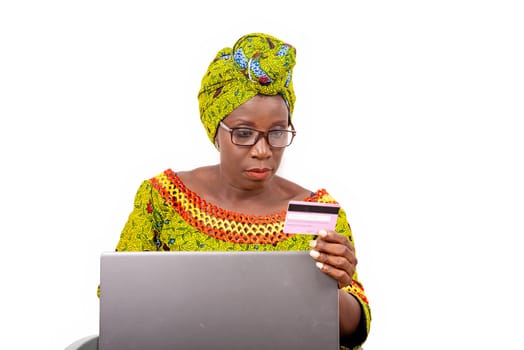 beautiful mature woman in eyeglasses isolated on white background doing online shopping.