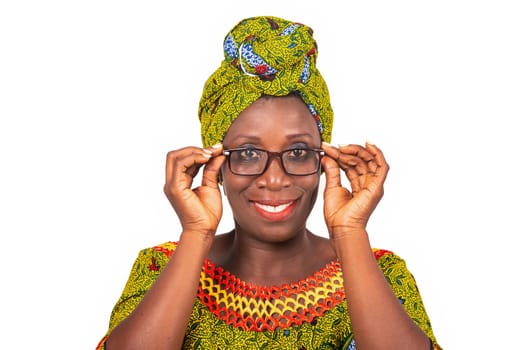 beautiful african adult woman dressed in green loincloth is wearing beautiful glasses with eyes smiling