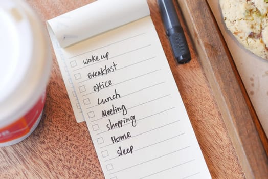 Notepad features daily tasks alongside breakfast coffee and pastry.