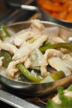 A delicious chicken stir-fry featuring bell peppers and onions on display.