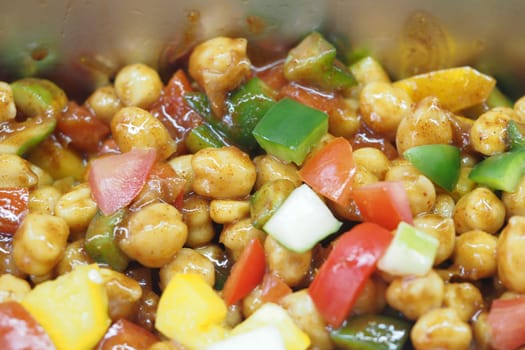 Chickpeas with colorful veggies and spices make a nutritious meal.