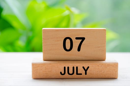 July 7th calendar text on wooden blocks with customizable space for text. Calendar concept.