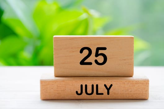 July 25th calendar text on wooden blocks with customizable space for text. Calendar concept