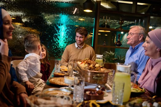 Grandparents arrive at their children's and grandchildren's gathering for iftar in a restaurant during the holy month of Ramadan, bearing gifts and sharing cherished moments of love, unity, and cultural exchange, as they eagerly await their meal together.
