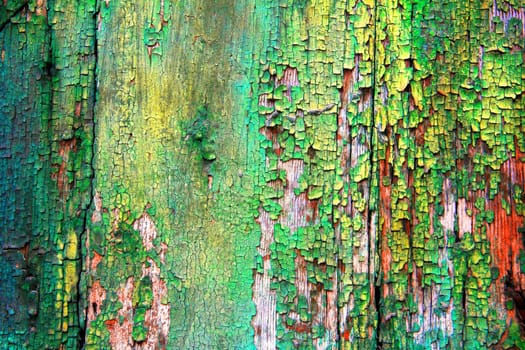 Background from an old wooden board with peeling green paint