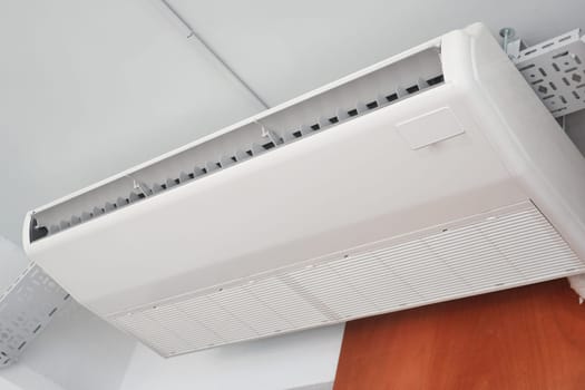 An air conditioning unit provides cool air in a contemporary room setting.