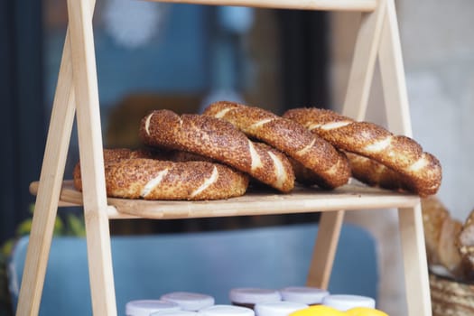 Freshly baked turkish simit displayed in a cozy cafe setting,