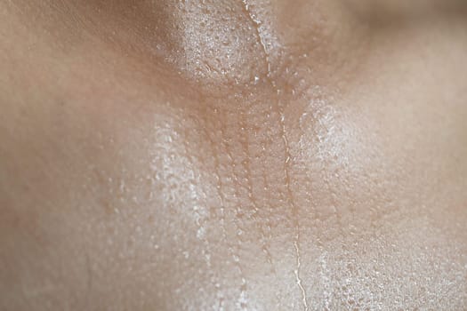 Glimmering skin reveals droplets of sweat and natural detail.