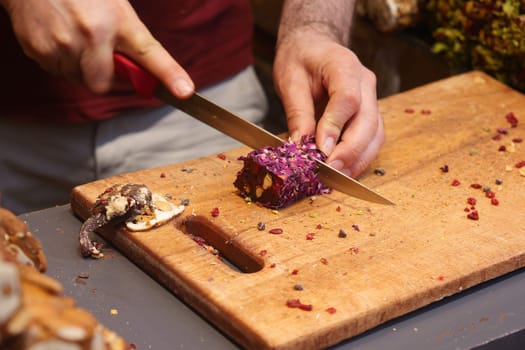cutting turkish delight on a chopping board ,